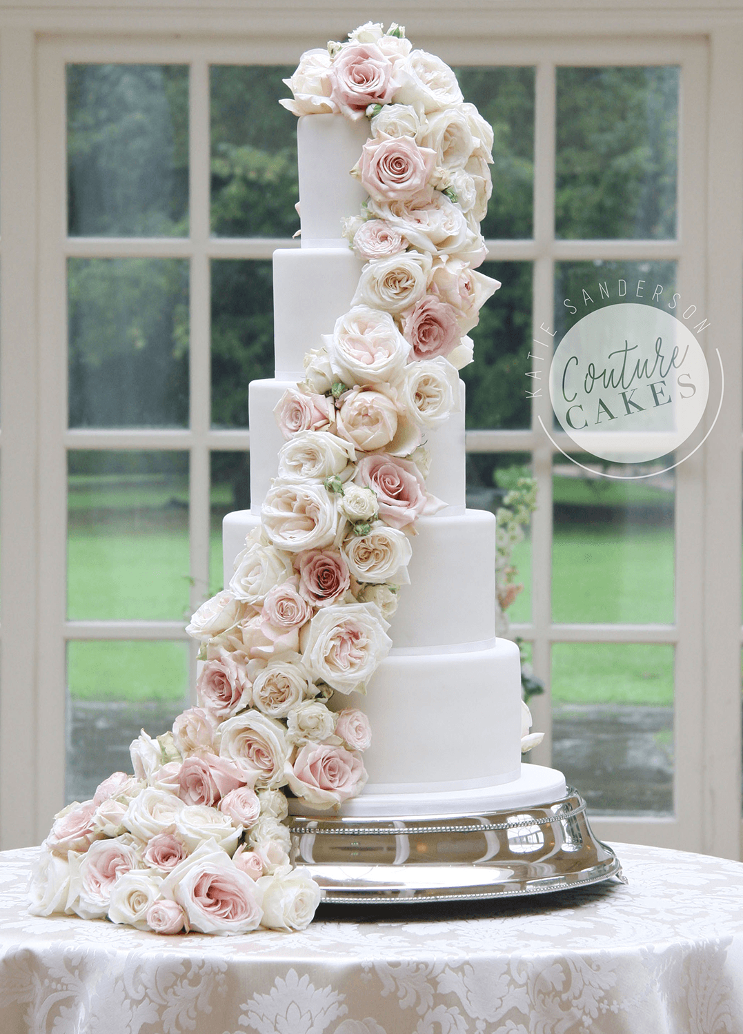 Cascading Roses Wedding Cake:  Serves 220 portions, Price category A £695 plus flowers £120-200