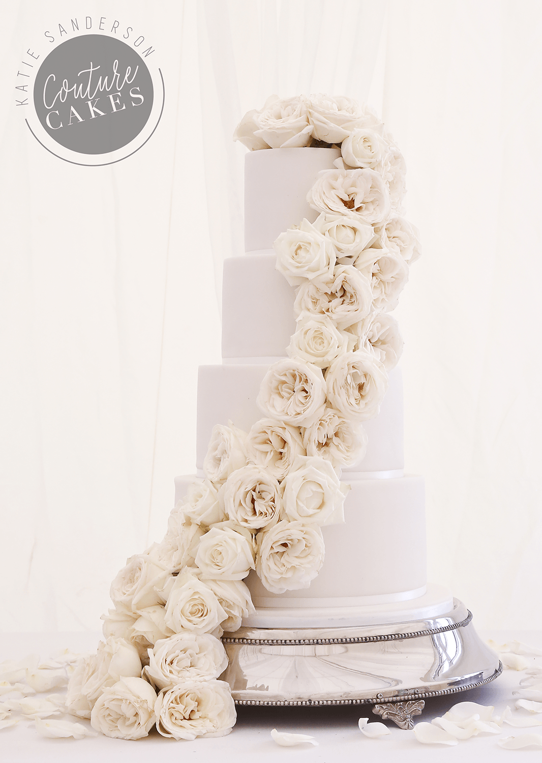 Ivory Cascading Roses Wedding Cake: Serves 170 portions, Price cat A, £545, plus £150 flowers